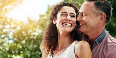 smiling couple hugging