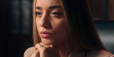 worried woman with no social skills sitting alone at home