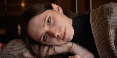 serious woman raised by gen z parents struggling