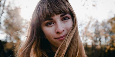 woman with low intelligence thinking of ideas outside