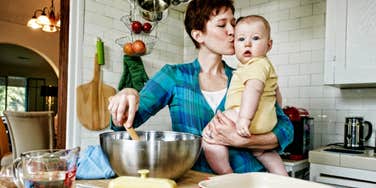 woman kissing baby