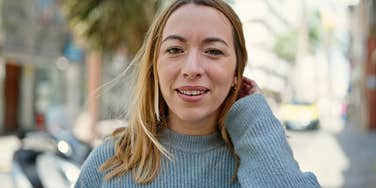 woman who lacks common sense standing outside