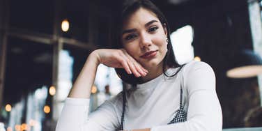 jealous judgmental woman looking annoyed and smug