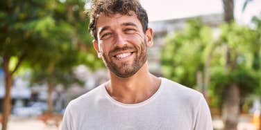 happy man smiling after experiencing a spiritual journey