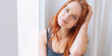woman homebody sitting at home thinking