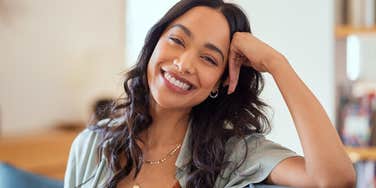 introverted woman with high intelligence smiling
