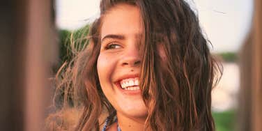 Calm happier human after letting go of perfectionist habits. 