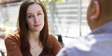 woman who doesnt respect her husband ignoring him during dinner