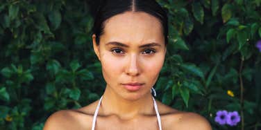 Pensive person reflecting, illustrating ways to rebuild trust after being betrayed by someone you love.