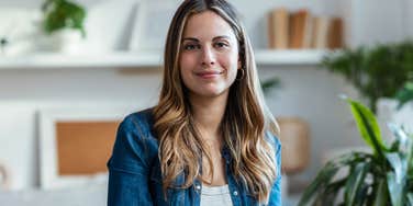 upper middle class woman smiling at home