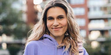 authentic young woman smiling outside