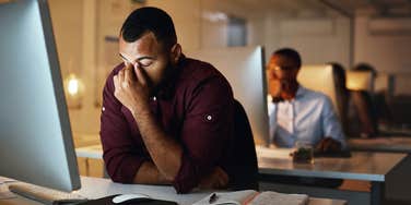 tired man who can't have work-life balance and success