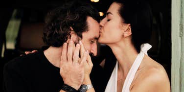Woman comforting man sweetly, making him feel safe and loved. 