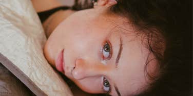 Woman decodes meaning of dreams.