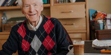 elderly man drinking coffee