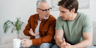 gen z son talking to his dad in the home they share
