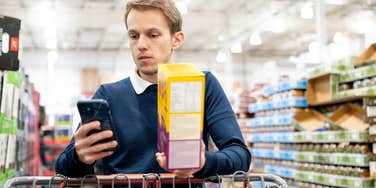 man grocery shopping raising money buy groceries
