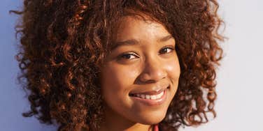 Woman holds onto the light.