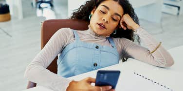 woman who hates talking on the phone looking at incoming call