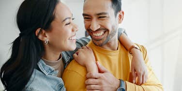 happy husband looking at wife in healthy marriage