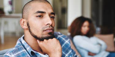 upset husband feeling taken for granted turned away from wife