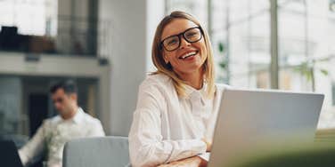 happy co-worker who thinks her job is her entire life