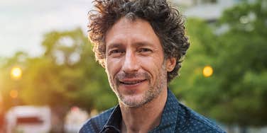 confident middle aged man smiling