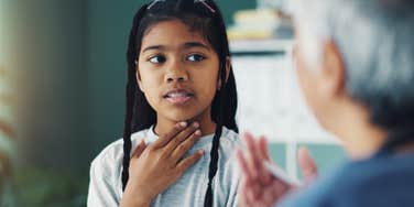 Neurodivergent girl explaining her meltdowns and outbursts to a parent 