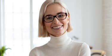 happy woman raised to not blame people