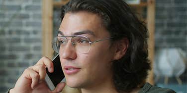 Person takes phone call.