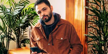 Man who isn't serious abouyt you, playing phone games.