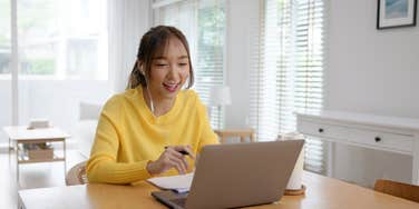gen z employee working at laptop from home
