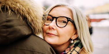 Woman leaning on man for comfort, representing emotional connection, compassion, and true love during times of loss