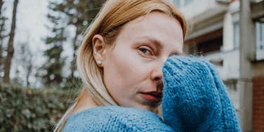 empathic woman absorbing emotions of others looking sad