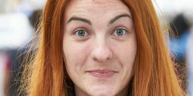 Woman is bored out of her brain.