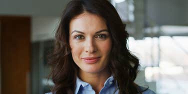 gen x woman smiling slightly