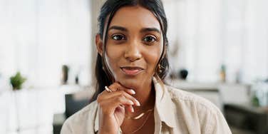 intelligent woman with genius energy thinking deeply at work