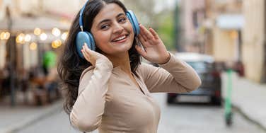 intelligent woman listening to music to calm herself
