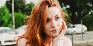 Close-up of a sad, pensive woman symbolizing the emotional work of breaking painful family patterns.