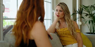 frustrated woman talking with friend who always has to be right