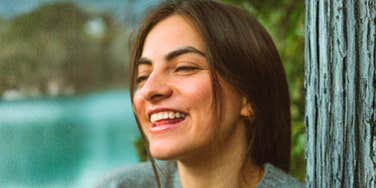 Woman declaring she was going to be happy, with a painful life long condition.