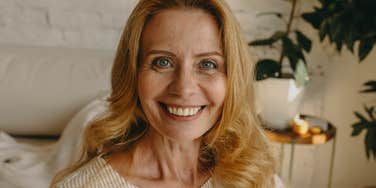 happy older woman smiling at home