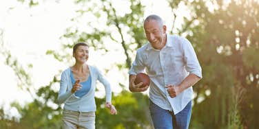 older man playing football