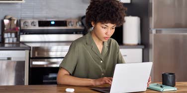 young woman working on laptop