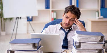 stressed employee sitting at desk