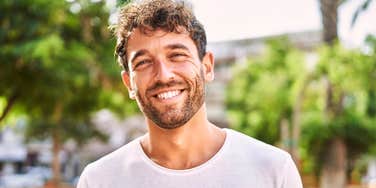 Attractive confident man with calm, focused expression representing emotional maturity, strength, and the loving behaviors of real men who know how to cherish and respect good women.