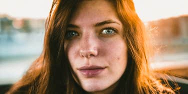 Person offering a sincere heartfelt apology with soft eye contact showing the art of saying sorry and the habits of people who apologize with real heart.