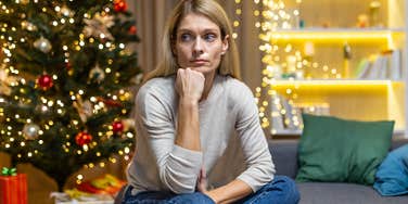 broke woman stressed about affording christmas gifts