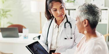 woman getting checkup at doctor's office