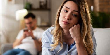 woman wondering if it's love or loneliness keeping her in a relationship